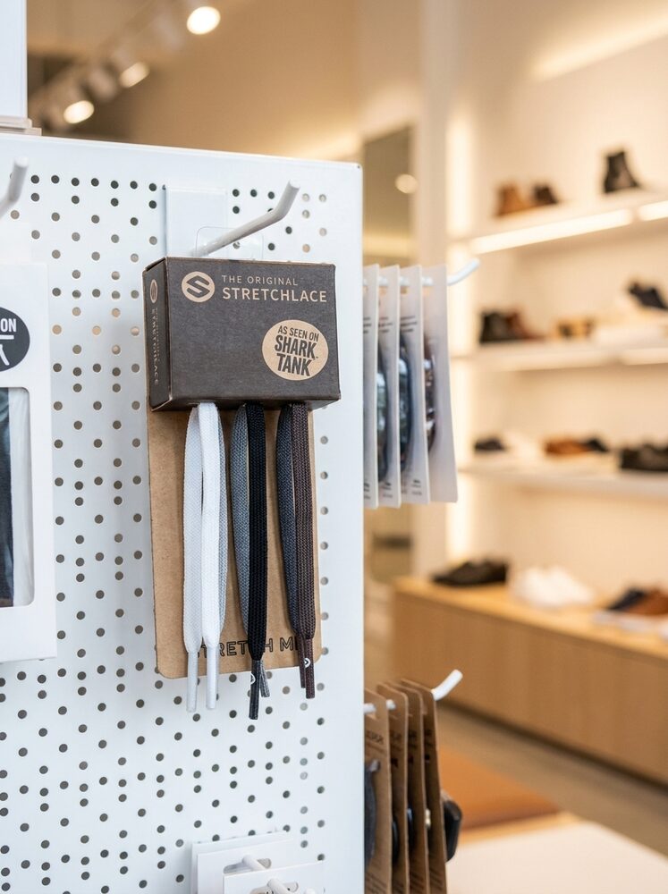 The Original Stretchlace STRETCH ME peg display on a pegboard